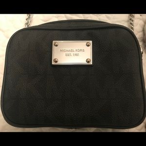 Michael Kors small cross-body “camera bag.”